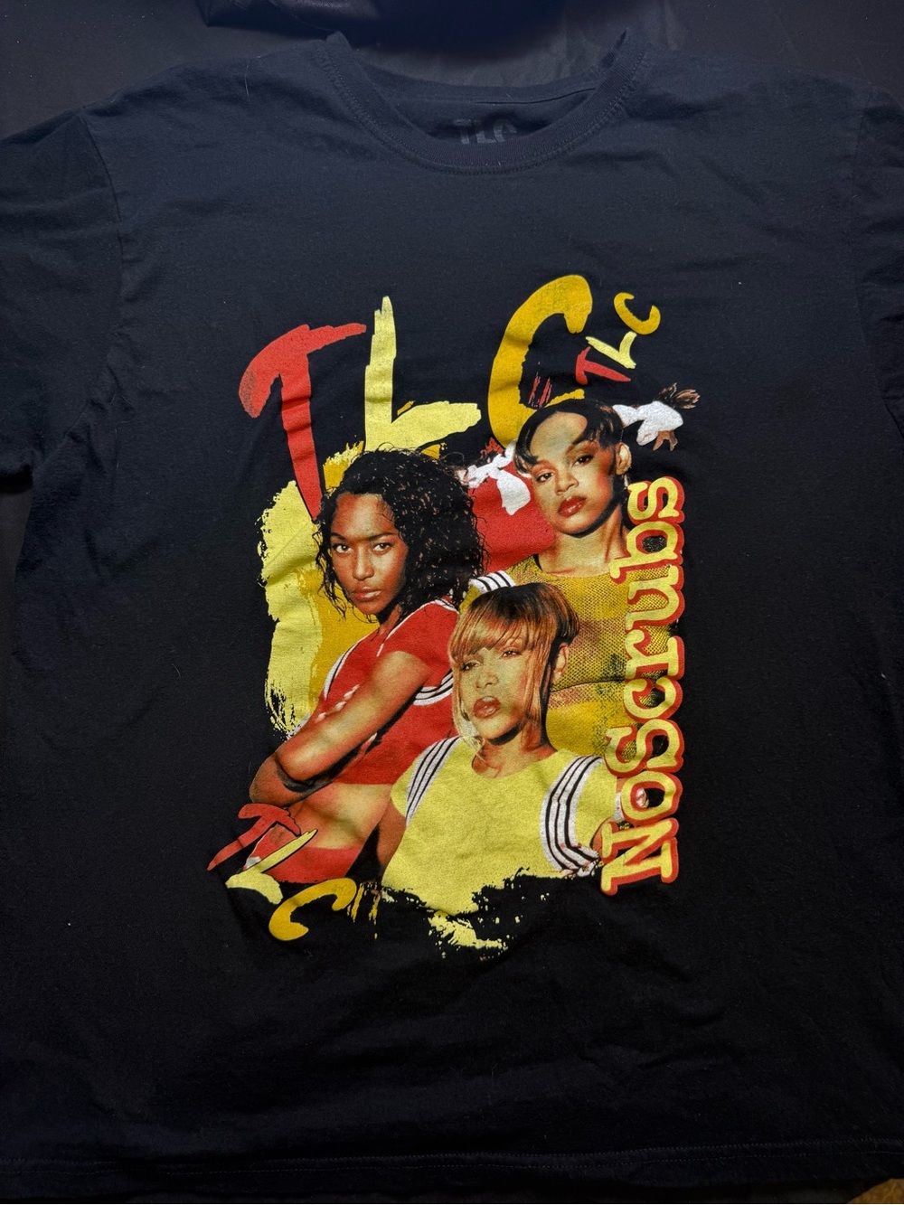 TLC Black Tee with Red & Yellow Band Graphic